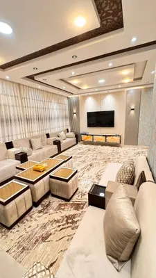 a large living room with couches and a flat screen tv at شقق فندقية فاخرة عمّان in Amman