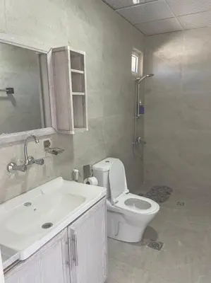 a bathroom with a toilet and a sink and a shower at Al-Karak Countryside and hotel in Ad Dimnah