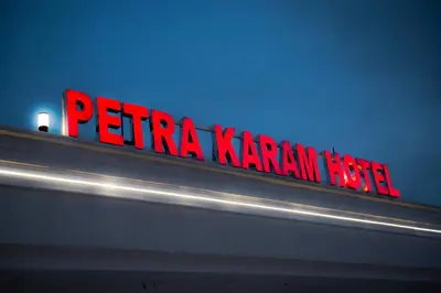 a red sign that sayseria karmann hotel on a building at Petra Karam Hotel in Wadi Musa