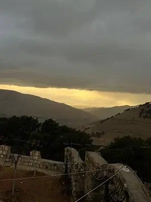 a view of a mountain with the sun setting at Heritige Inn Jordan in Ad Dimnah