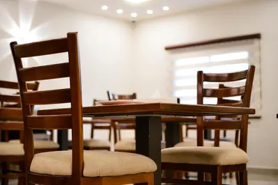 a dining room with a table and chairs at Petra Premium Hotel in Wadi Musa