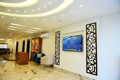 a lobby of a building with a tv on the wall at Petra Premium Hotel in Wadi Musa