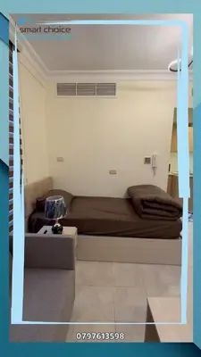 a bedroom with a bed in a room at gardens st 2 beds apartment 411 in Amman