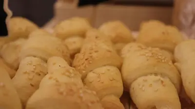 a pile of bagels sitting in a box at Sandy palace Hotel in Amman