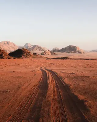 a dirt road in the middle of the desert at Wadi Rum Magic Stars in Wadi Rum