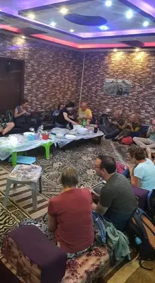 a group of people sitting in a room at Margaret from Petra cave house in Wadi Musa