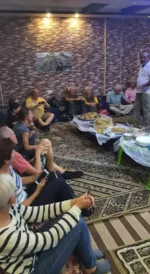 a group of people sitting in a room at Margaret from Petra cave house in Wadi Musa