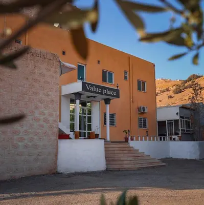 a building with a sign that reads value plaza at Value Place in Wadi Musa