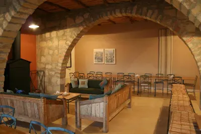 an archway in a room with a table and chairs at Dana Guesthouse in Dana