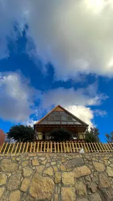a building on top of a stone wall at Dana luxury huts in Dana