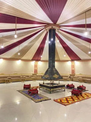 a large room with a large ceiling with a stage at RUM ARIZONA lUXURY CAMP in Wadi Rum
