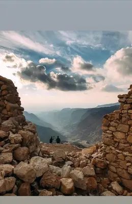 two people standing on top of a rocky mountain at Dana Village Lodge in Dana