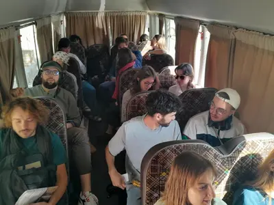 a group of people sitting on a train at Beirut Hotel 2 in Amman