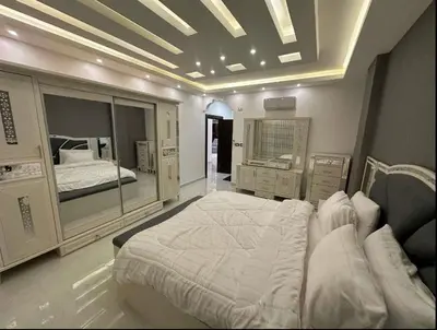 a bedroom with a large bed in a room at شقق فاخرة حي الشميساني الأردن in Amman