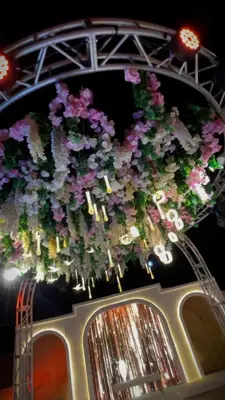 a bunch of flowers hanging over a car at فندق سفن روزز in Amman