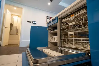 a kitchen with a cart with dishes in it at Boulevard, Abdali Luxury 1 BR Apartment in Amman