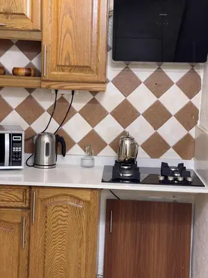 a kitchen counter with pots and pans on a stove at Beautiful & Cozy Newly remodeled 2 Bedroom in Amman