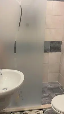 a bathroom with a sink and a toilet at G Guest House in Amman