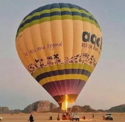a large hot air balloon in the desert at Wadi Rum Faris in Wadi Rum