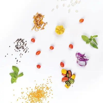 a collage of different spices and vegetables on a white background at JAZEERAT QUBTAN in Aqaba