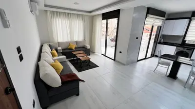 a living room with a couch and a table at شقة رووف اطلاله رائعه عمو سامي 20 in Amman