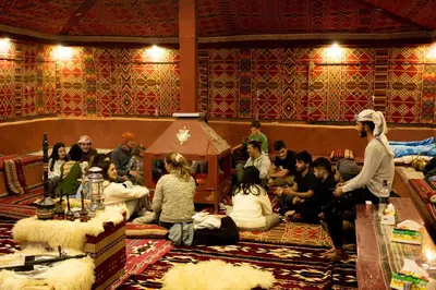a group of people sitting in a room at Moon shine camp in Wadi Rum