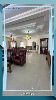a large living room with couches and a table at Tlaa al ali amman 3 rooms furnished apartment المحكمة الدستورية in Umm Uthainah