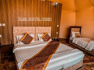 a bedroom with two beds in a room at sonia luxury camp in Wadi Rum