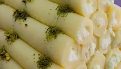 a pile of pasta with broccoli on top of it at Samira House in Amman