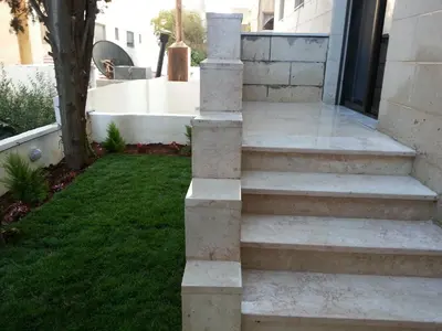 a set of stone steps leading to a house at Two Bedroom Shmeisani Apartment in Amman