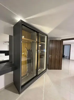 a room with a display case with a cat in it at Stylish Luxe Apartment F/R 0004 in Amman