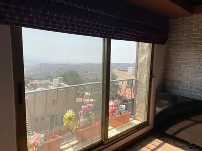 a window with a view of a city at Horizon Loft in Bilāl