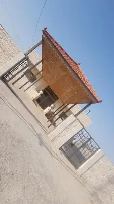 a building with a staircase on the side of it at Laura's Stylish Villa in Madaba