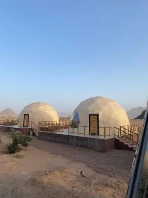two domes in the middle of the desert at Omar Camp Wadi Rum in Disah
