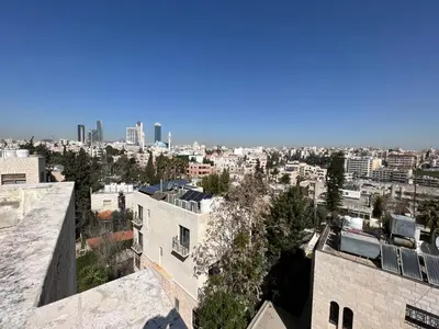 an aerial view of a city with buildings at Super modern comfortable apartment at the heart of historic Amman in Amman
