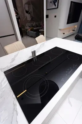 a kitchen counter top with a stove top oven at Luxurious in Abdoun Tower at 11th Floor in Amman