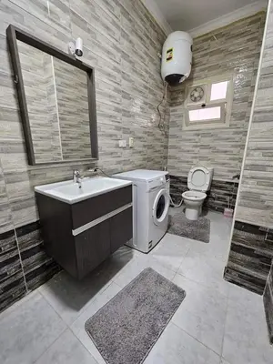 a bathroom with a sink and a toilet at Holy land in Amman
