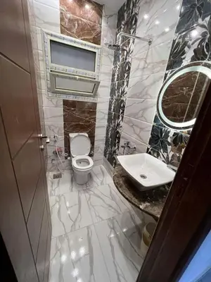 a bathroom with a toilet and a sink at Holy land in Amman