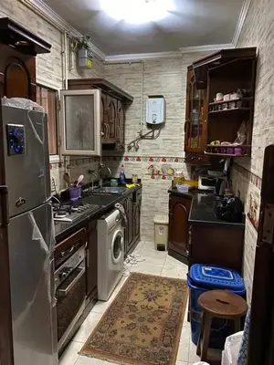a kitchen with a stove and a dishwasher at Holy land in Amman