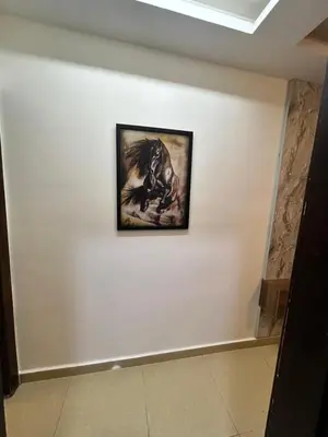 a painting of a horse on a white wall at Luxury Hotel apartment in Amman