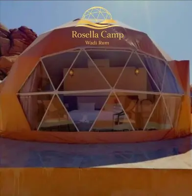 a tent that is sitting on top of a field at Rosella Camp Wadi Rum in Wadi Rum