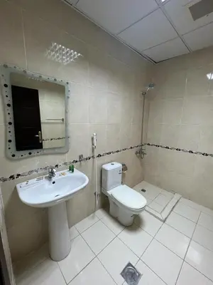 a bathroom with a sink and a toilet and a mirror at 2332 Guest House in Irbid