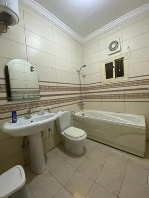 a bathroom with a sink and a toilet and a bath tub at 2332 Guest House in Irbid