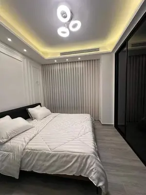 a bedroom with a large bed with a ceiling at Maan 12 in Ma‘ān