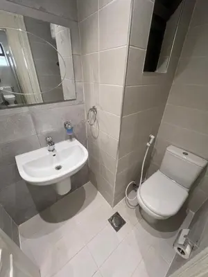 a bathroom with a toilet and a sink at Casa De Centre 2 in Amman