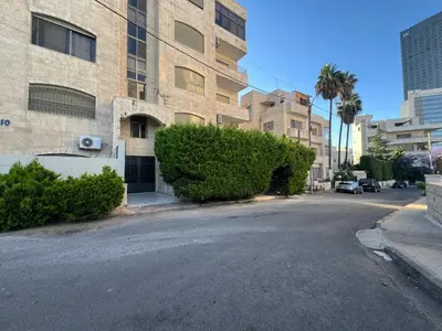 an empty street in front of a building at Casa De Centre 2 in Amman