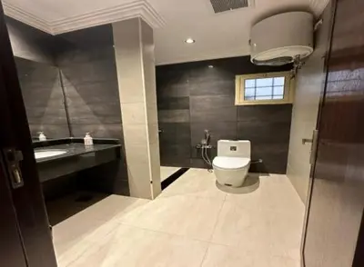 a bathroom with a toilet and a sink at 89 inn in Amman