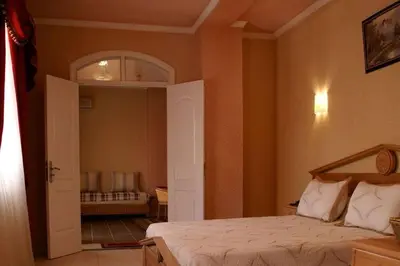 a bedroom with a bed and an open door at 89 inn in Amman