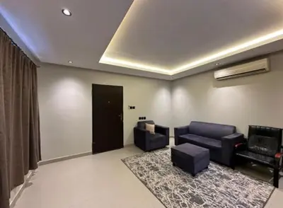 a living room with two chairs and a couch at 89 inn in Amman