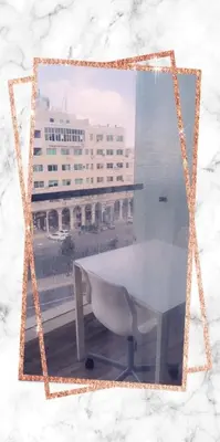 a picture of a white table and a building at Lovely Studio appartment in a central location in Amman